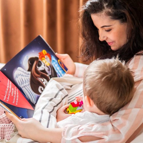 Ornella reading "Miracle of Life" to her son.