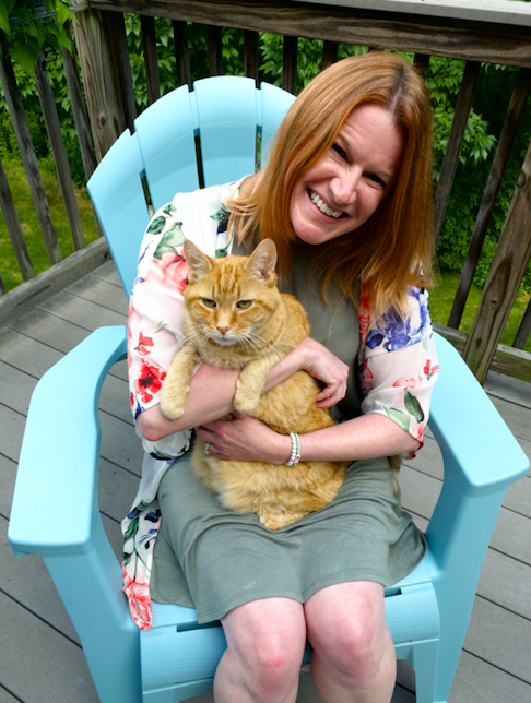 Laura Williams-Burke with her pet and the inspiration behind her book, Milton!
